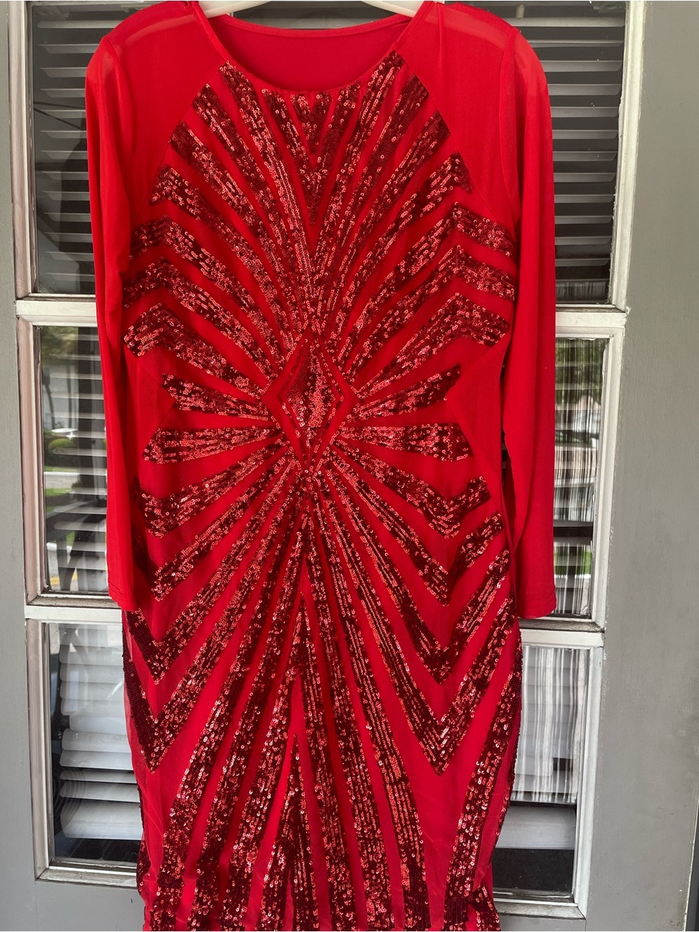 Red sequined long sleeved dress